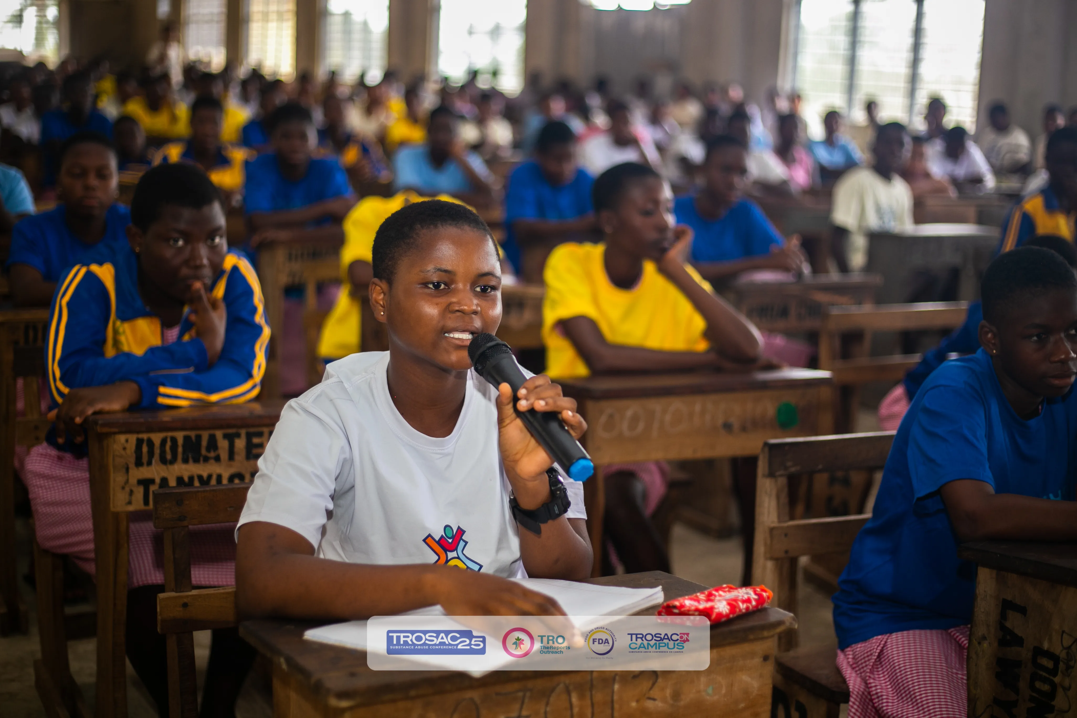 Trosac Banner image featuring a young SHS girl asking a question